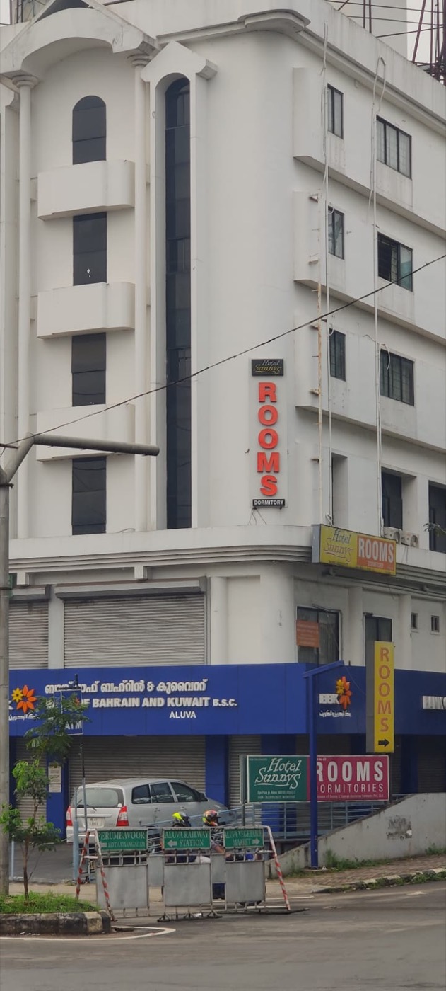 Hotel Sunnys corner sign for rooms and dormitory